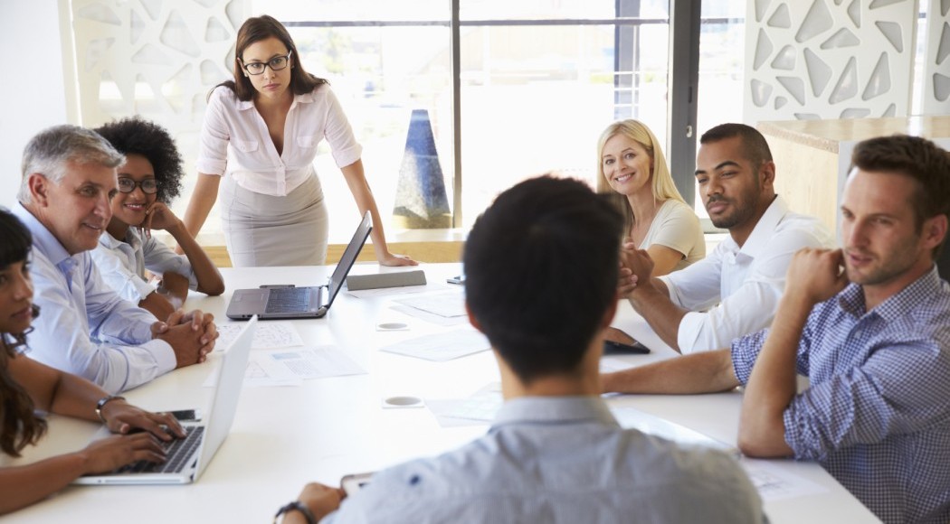 Businesswoman presenting to colleagues at a meeting